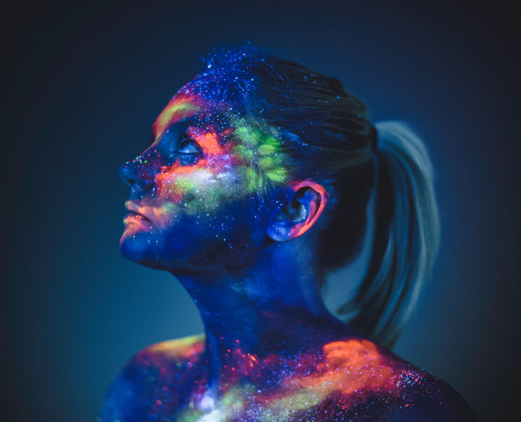 portrait-of-a-girl-painted-in-fluorescent-uv-color-VQL58MD